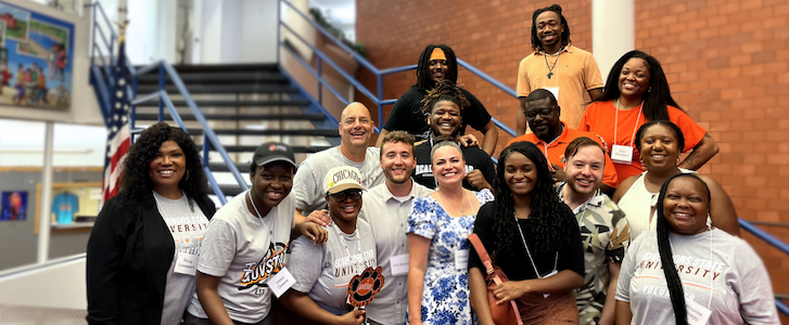 A group of people smiling A group of people smiling